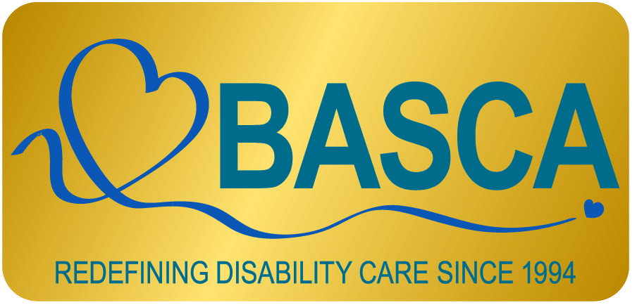 BASCA's new logo, blue text on a gold background. The logo is a blue ribbon in the shape of a heart next to the words "BASCA: Redefining Disability Care since 1994"