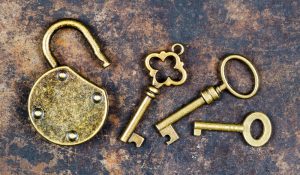 old fashioned keys and opened lock